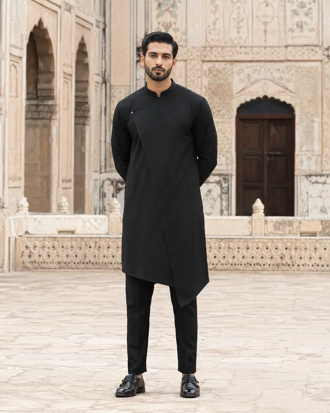 Model wearing Adil black asymmetric set