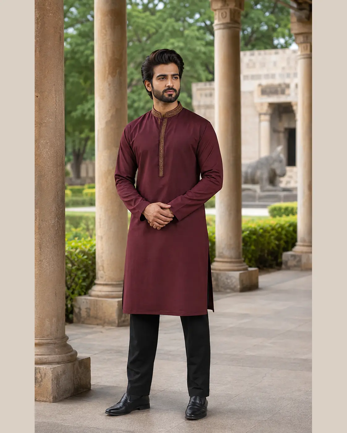 Model wearing Saif maroon embroidered set